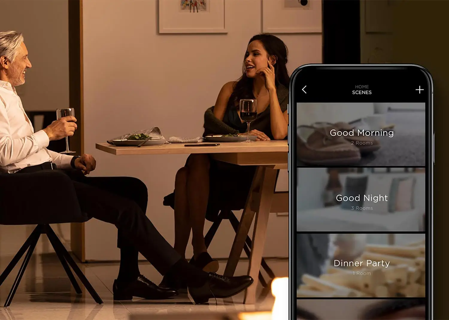 Warm dinner scene with two people toasting over wine, alongside a smartphone showing home‑automation scenes like Good Morning, Good Night, and Dinner Party.